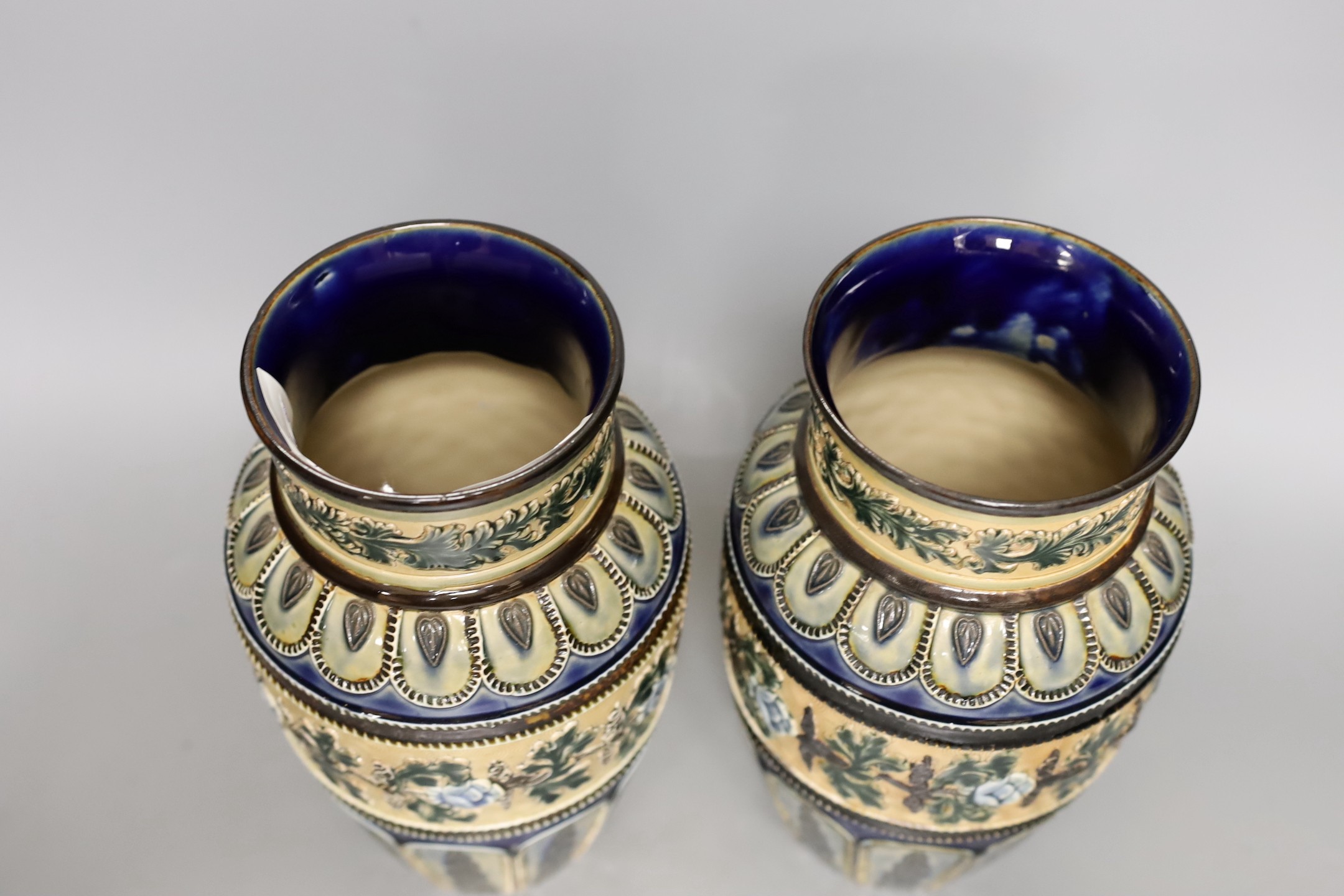 A pair of Doulton Lambeth vases, c.1885, 25.5cms high (a.f.)